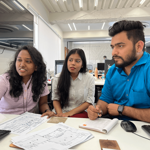 JTCPL Designs team in discussion, sharing ideas and collaborating on a project