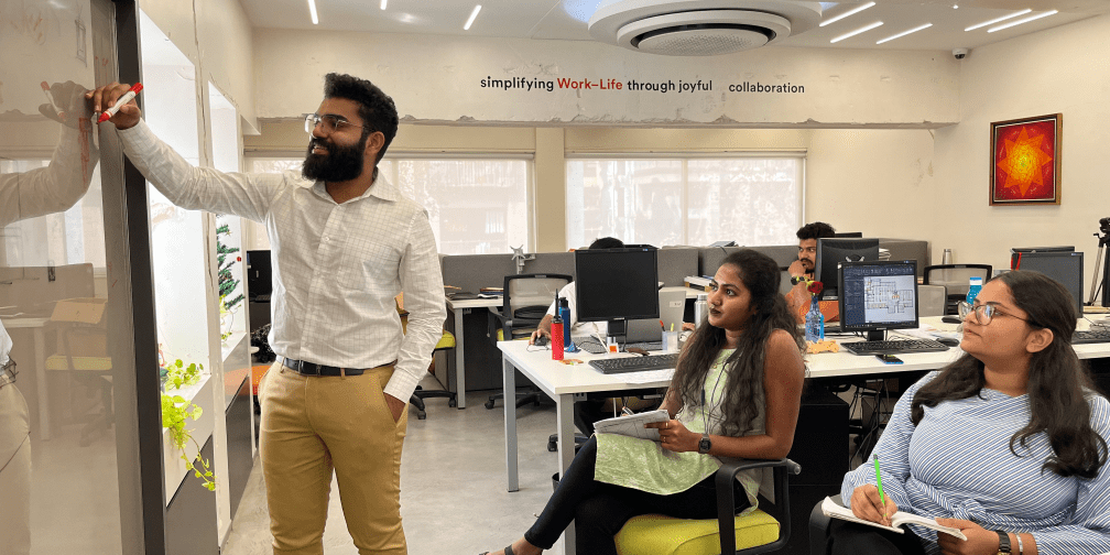 Team members at JTCPL Designs engaged in a brainstorming session, discussing ideas