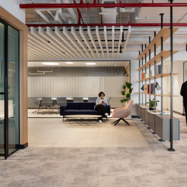 Open-plan workspace by JTCPL Designs, combining industrial and elegant styles