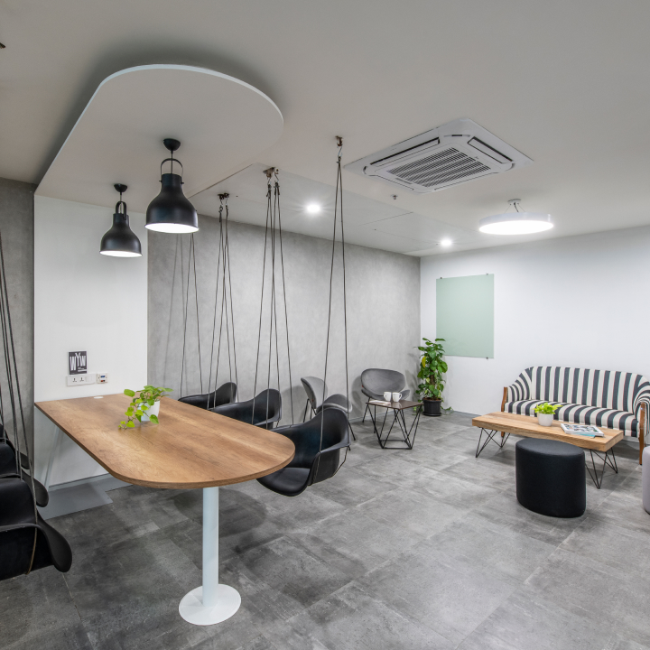 A modern and playful office space with a unique seating arrangement